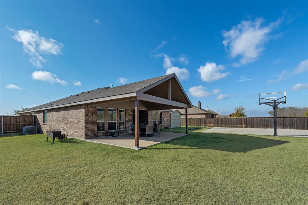 343 Amber Lane Nevada, TX 75173 - Photo 31 of 33 a view of a house with a backyard
