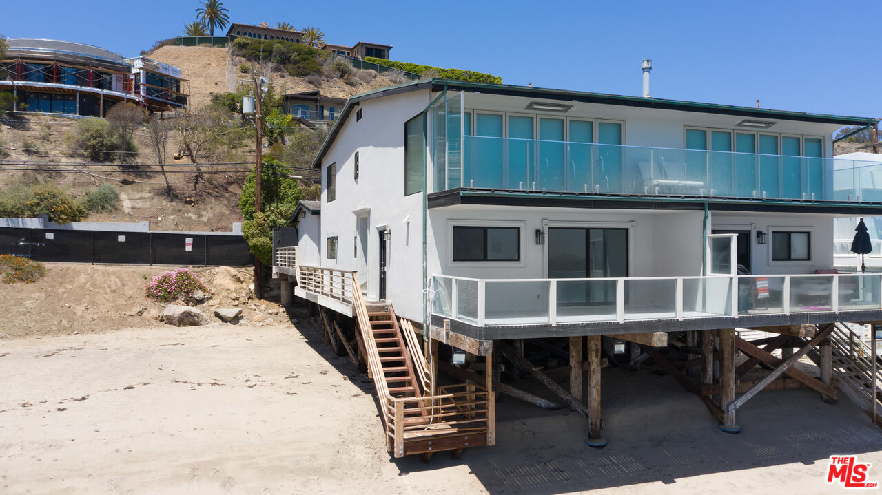25218 Malibu Road Malibu, CA 90265 - Photo 1 of 9 a view of a house with a yard