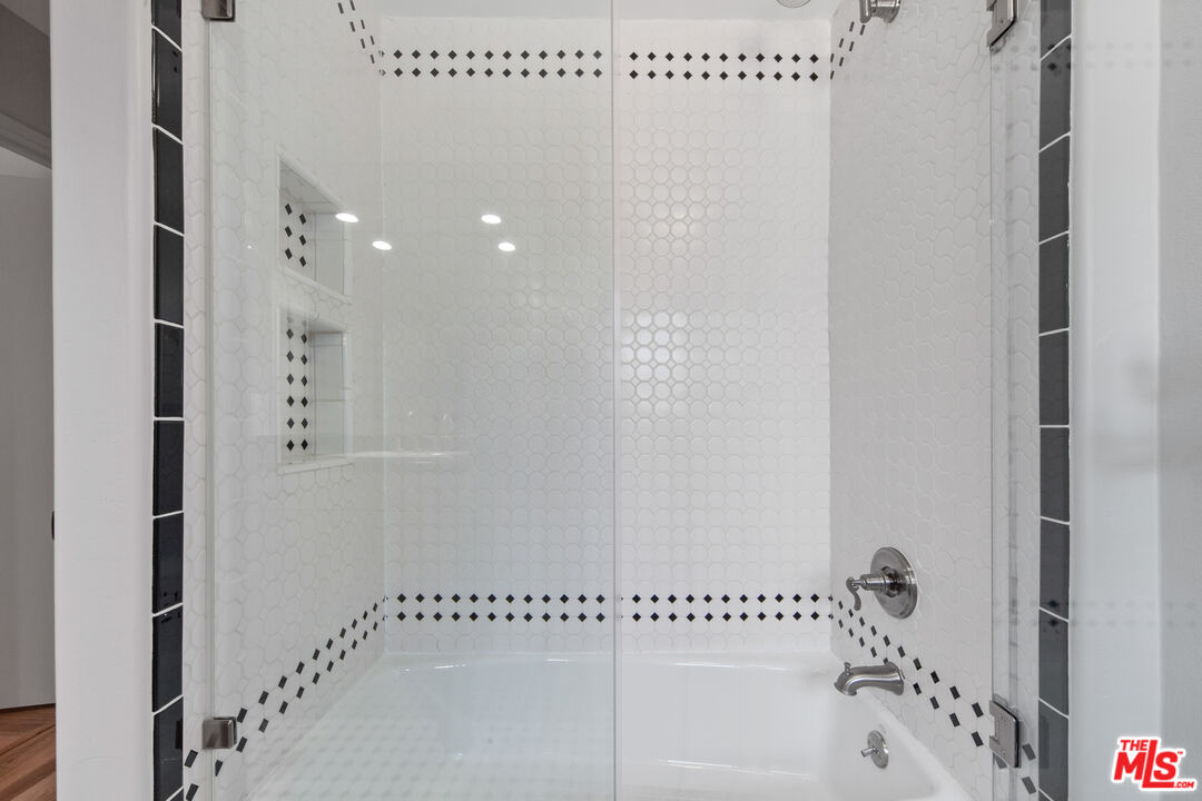 25218 Malibu Road Malibu, CA 90265 - Photo 7 of 9 a bathroom with a bathtub and shower
