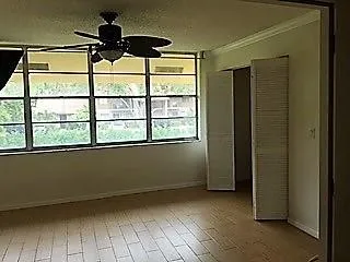 a view of an empty room with a window