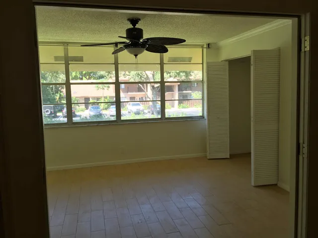 a view of an empty room with a window