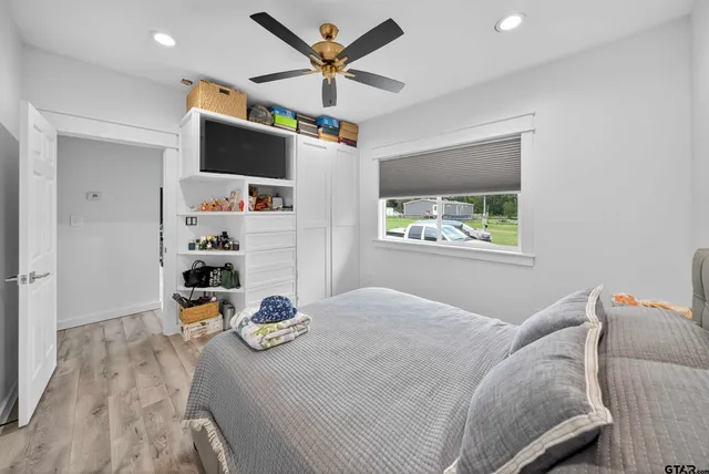 a bedroom with a bed and a window