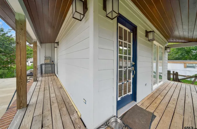 a view of front door of house with yard