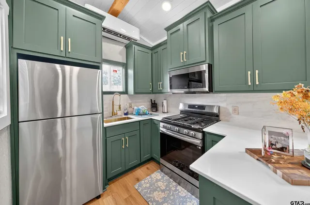 a living room with furniture and large window