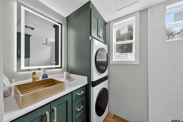 a bedroom with bed and cabinets