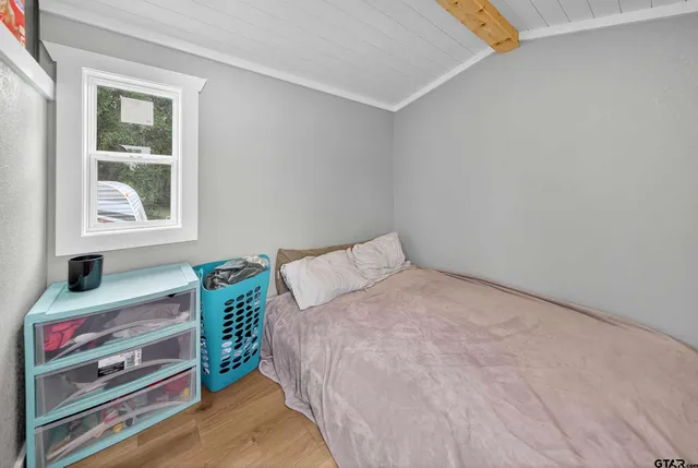 a view of a livingroom with an empty space and a window