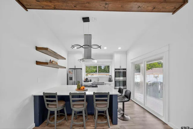 a view of a dining room with furniture