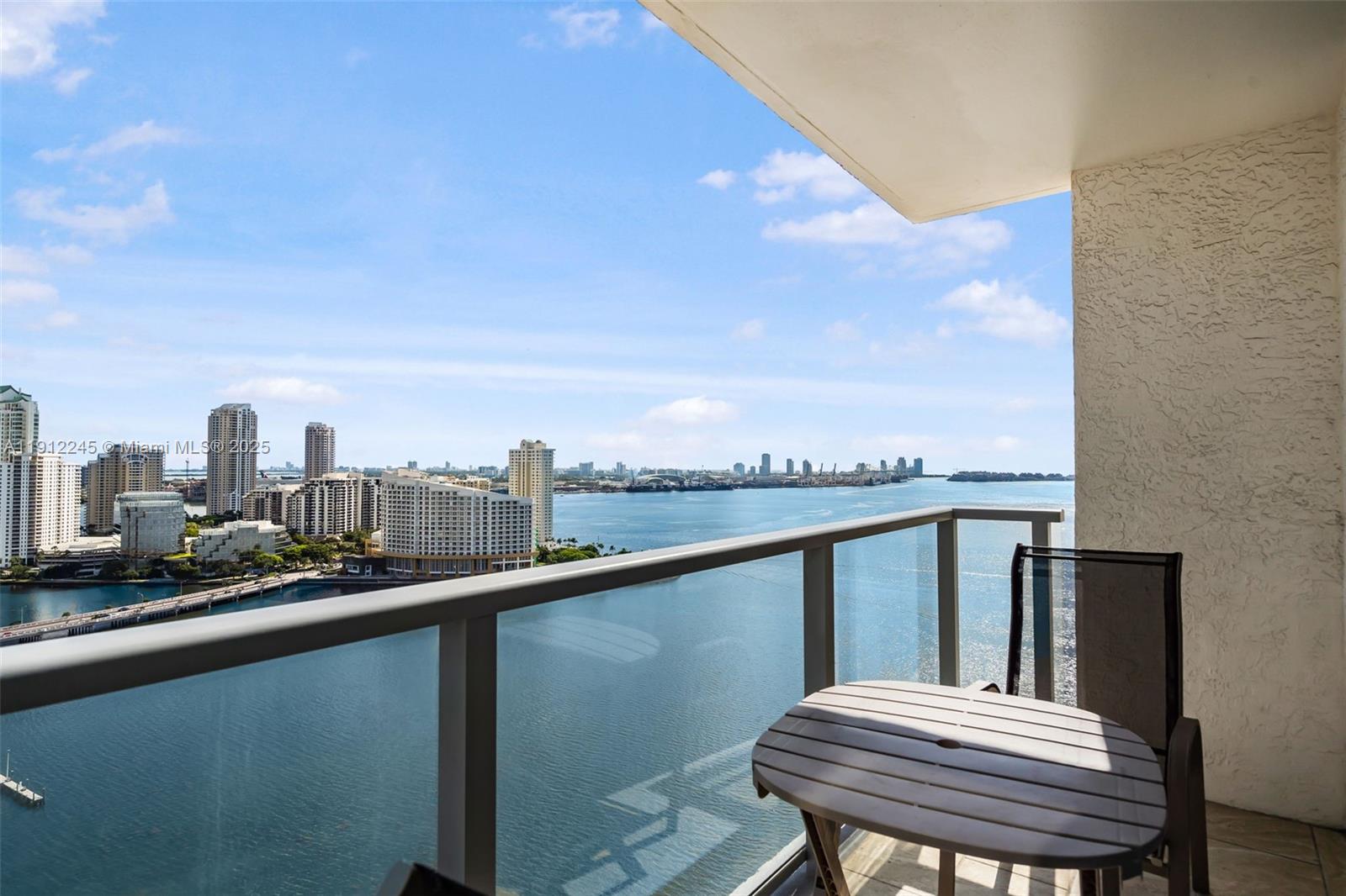 1155 Brickell Bay Drive, Unit 2708 Miami, FL 33131 - Photo 4 of 19 a view of a balcony with two chairs