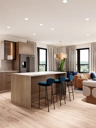 a living room with furniture a rug kitchen view and a large window