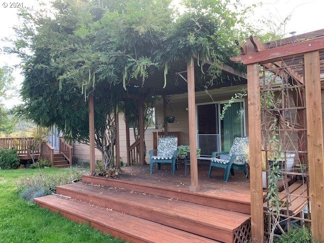 3123 South Side Road Sutherlin, OR 97479 - Photo 14 of 30 a view of a house with backyard and sitting area