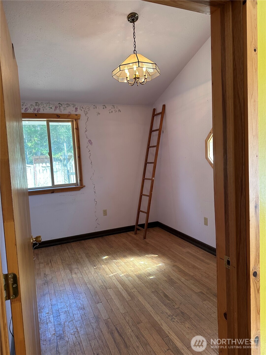 641 Decatur Head Drive Decatur Island, WA 98221 - Photo 19 of 40 an empty room with window wooden floor and window