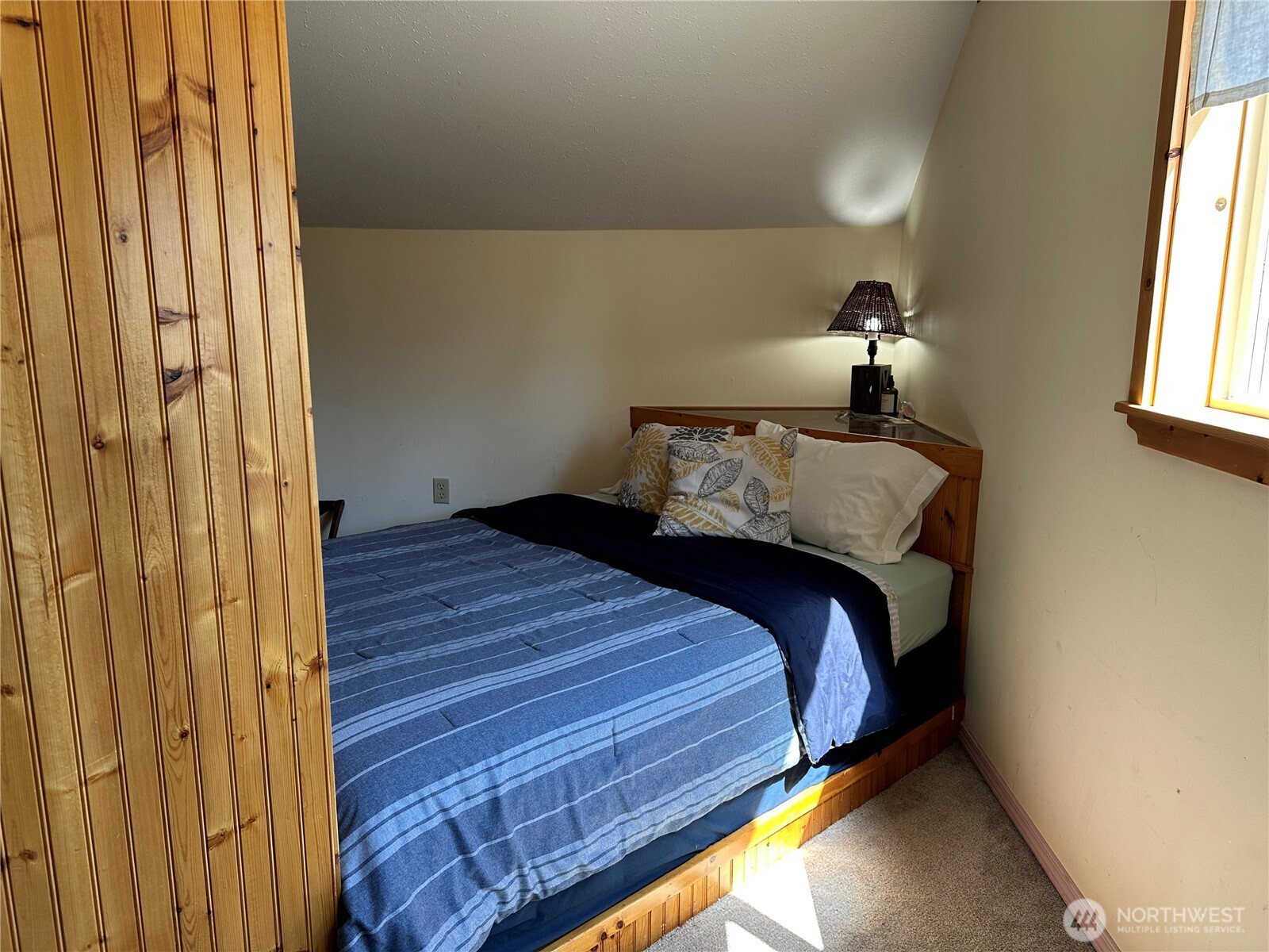641 Decatur Head Drive Decatur Island, WA 98221 - Photo 24 of 40 a bedroom with a bed and a window