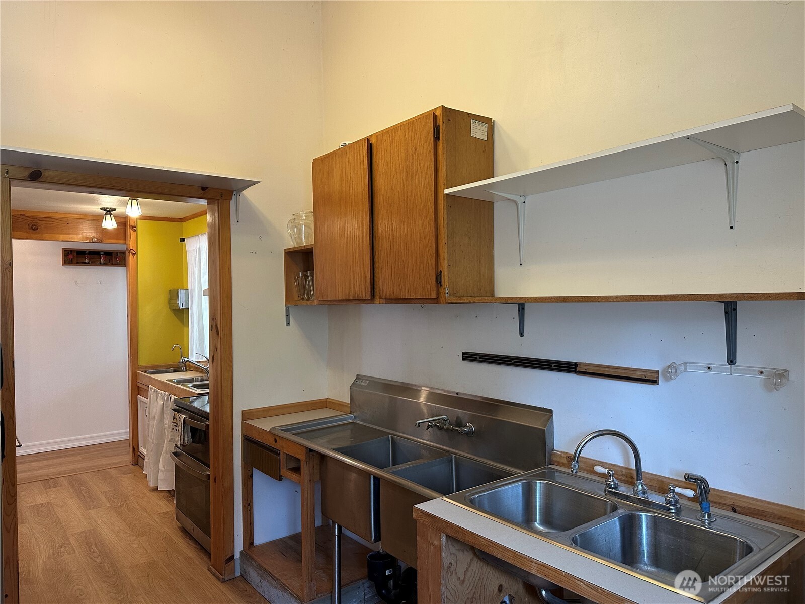 641 Decatur Head Drive Decatur Island, WA 98221 - Photo 9 of 40 a kitchen with stainless steel appliances a sink a stove and cabinets