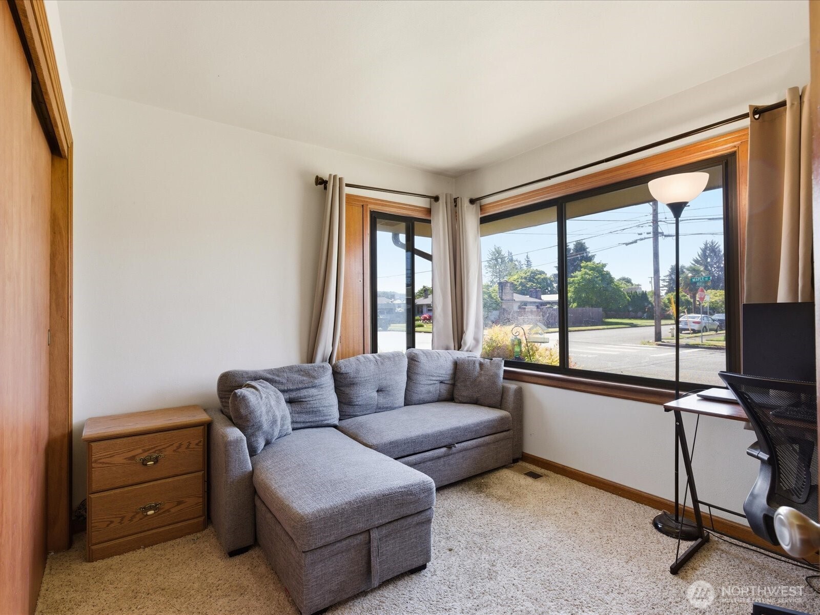 1417 Maple Street Sumner, WA 98390 - Photo 13 of 40 a living room with furniture and a floor to ceiling window