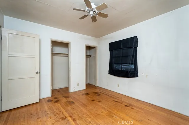 a view of a livingroom with a dishwasher and a white cabinet