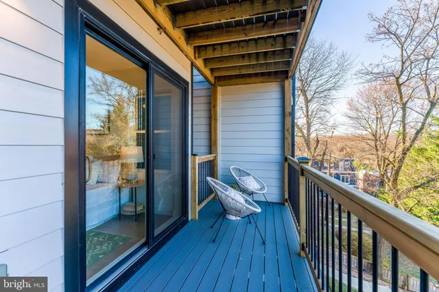 a view of balcony with wooden floor