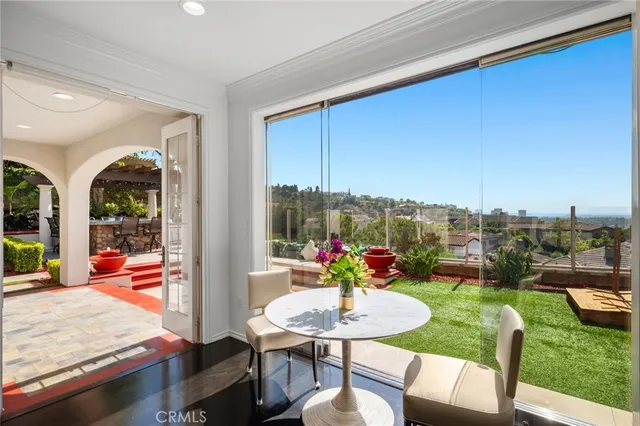 a outdoor dining space with furniture and a garden
