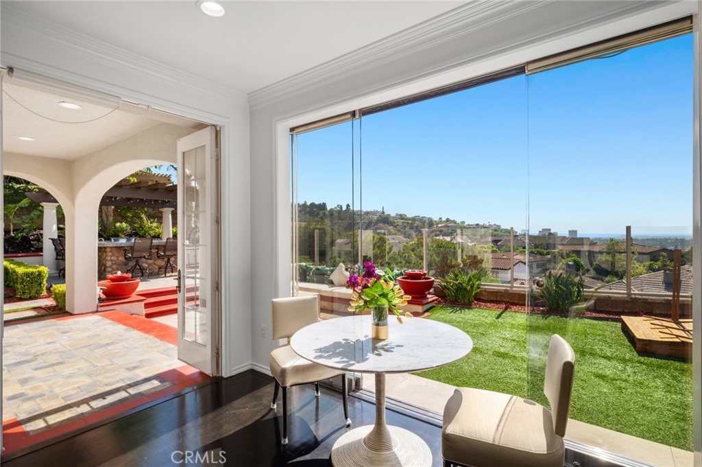 17 Lemans Newport Coast, CA 92657 - Photo 11 of 40 a outdoor dining space with furniture and a garden