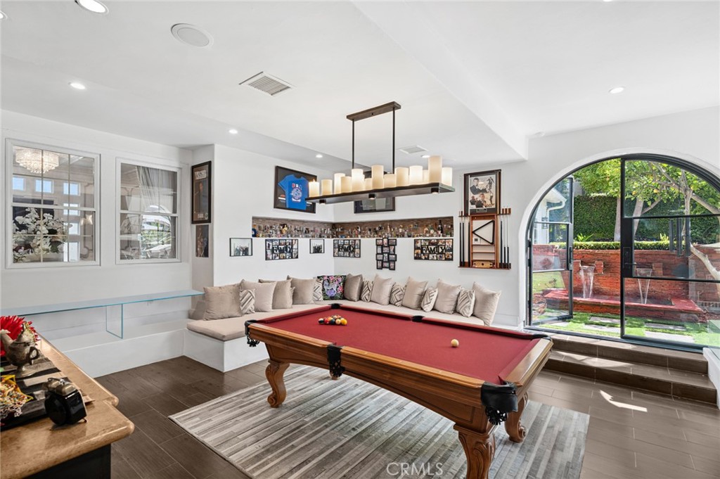 17 Lemans Newport Coast, CA 92657 - Photo 17 of 40 a living room with furniture a rug and a chandelier