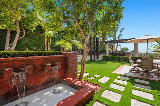 a view of a backyard with sitting area