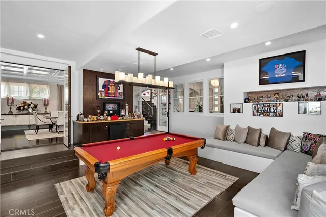a living room with furniture a rug and a flat screen tv
