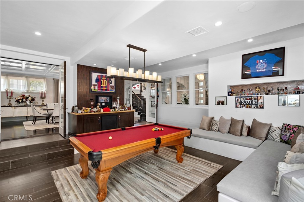 17 Lemans Newport Coast, CA 92657 - Photo 21 of 40 a living room with furniture a rug and a flat screen tv