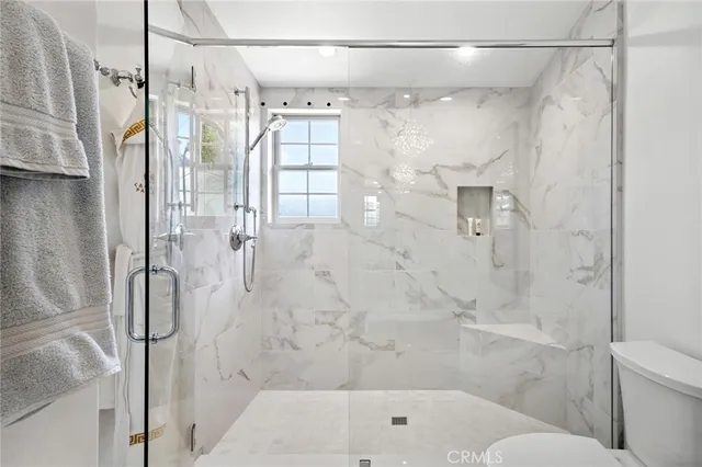 a bathroom with a shower and a toilet