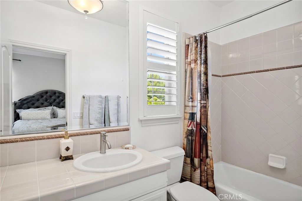 17 Lemans Newport Coast, CA 92657 - Photo 35 of 40 a bathroom with a sink a toilet and shower
