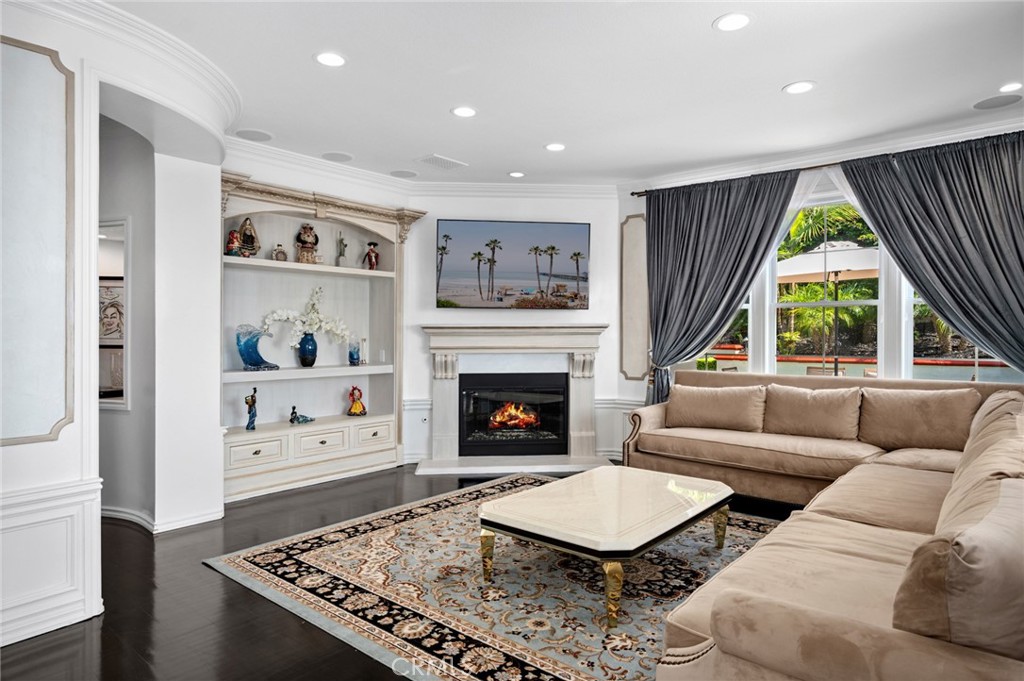 17 Lemans Newport Coast, CA 92657 - Photo 6 of 40 a living room with furniture and a fireplace