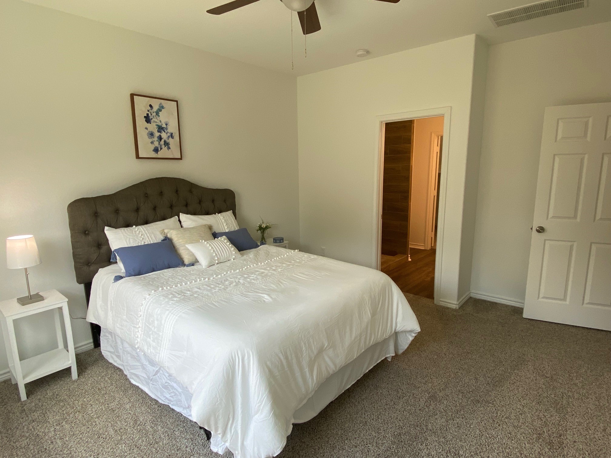24029 Wildwood Road, Unit 32 Porter, TX 77365 - Photo 11 of 20 a large bed sitting in a bedroom and a table