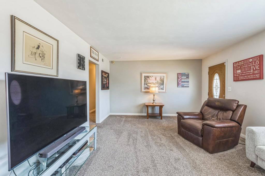 1350 Coy Court El Cajon, CA 92021 - Photo 11 of 30 a living room with furniture and a flat screen tv