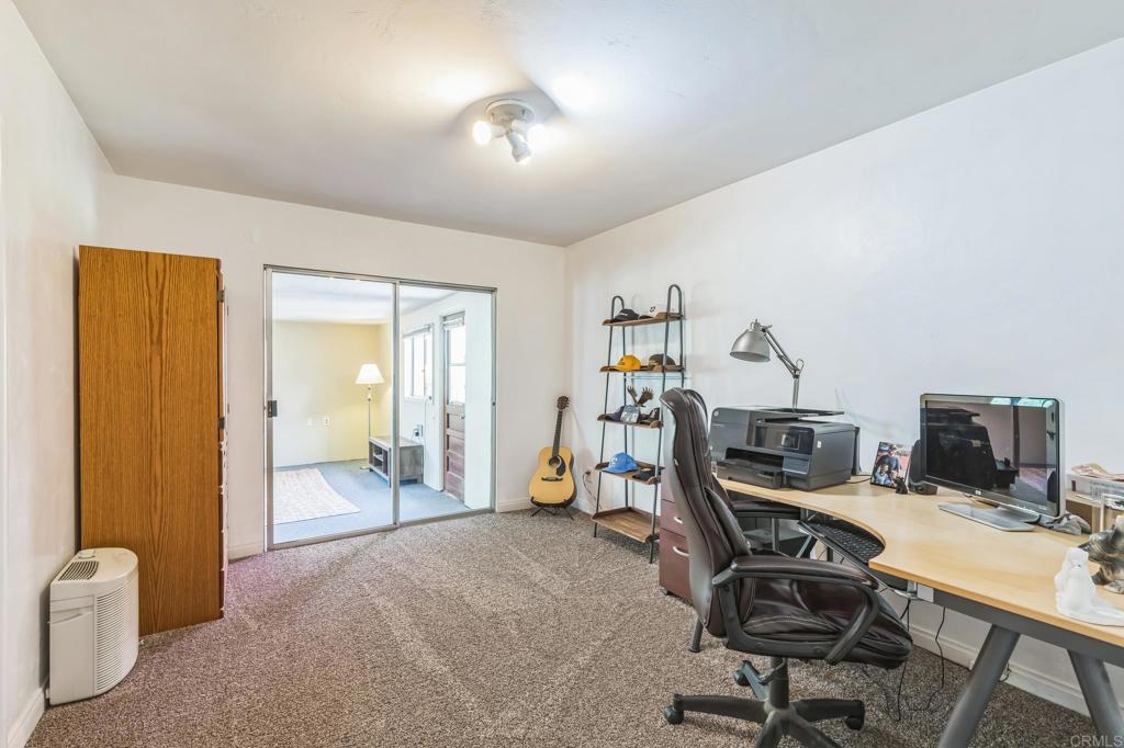1350 Coy Court El Cajon, CA 92021 - Photo 29 of 30 a view of a workspace with furniture and a window