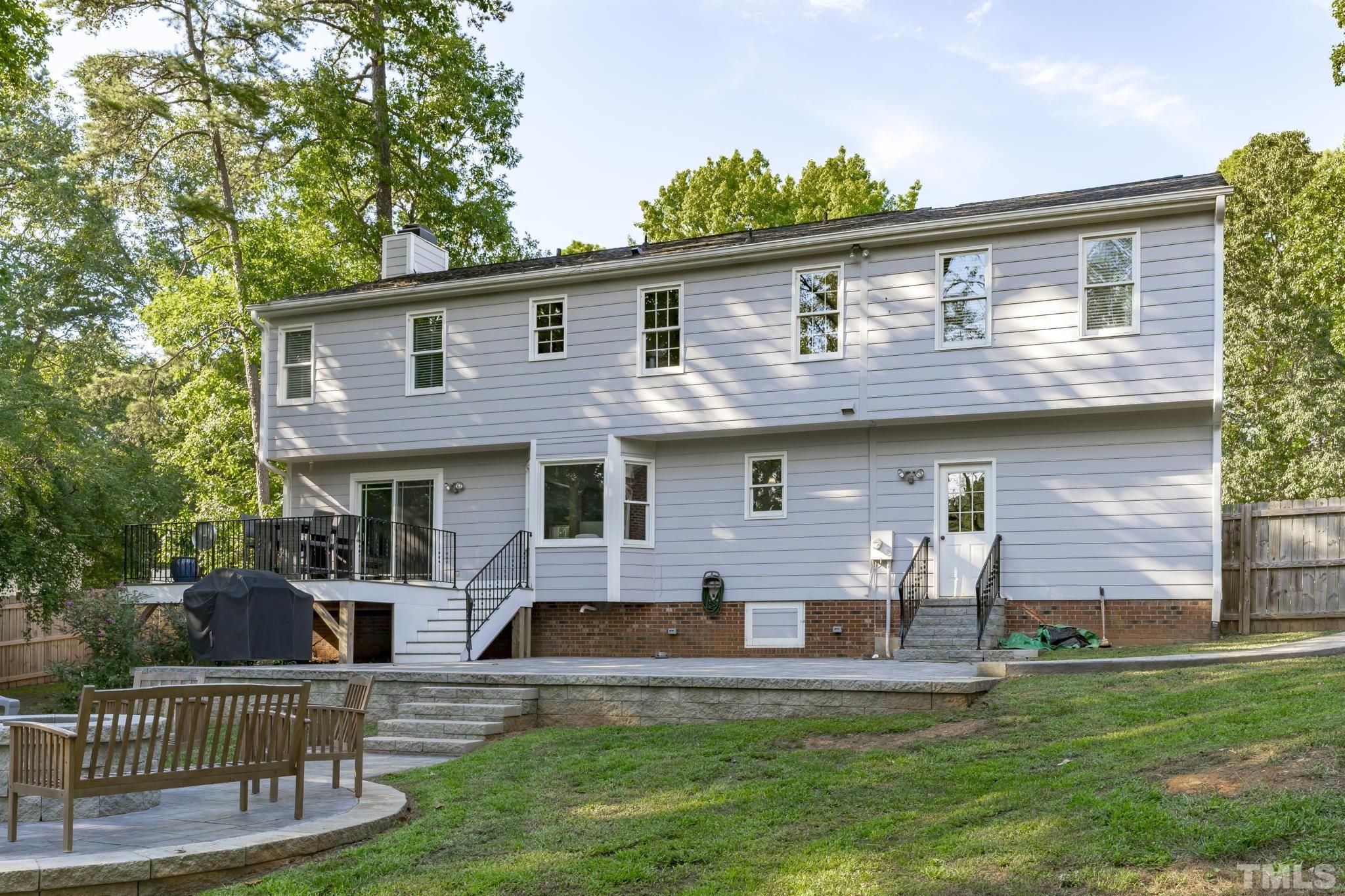 1001 Sawmill Road Raleigh, NC 27615 - Photo 8 of 48 a front view of house with yard and outdoor seating