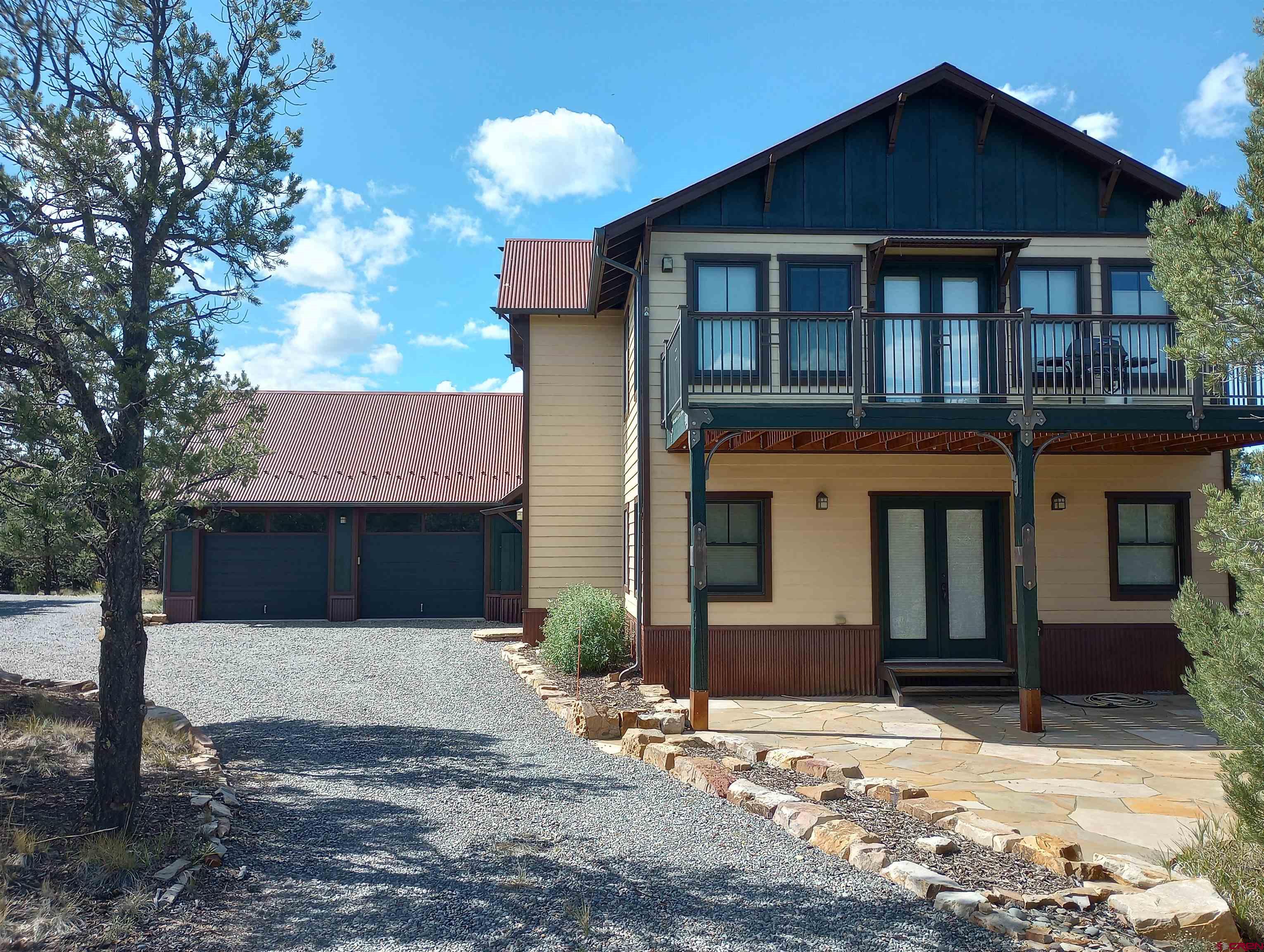 41 Oak Road Ridgway, CO 81432 - Photo 15 of 33 a front view of a house with a yard