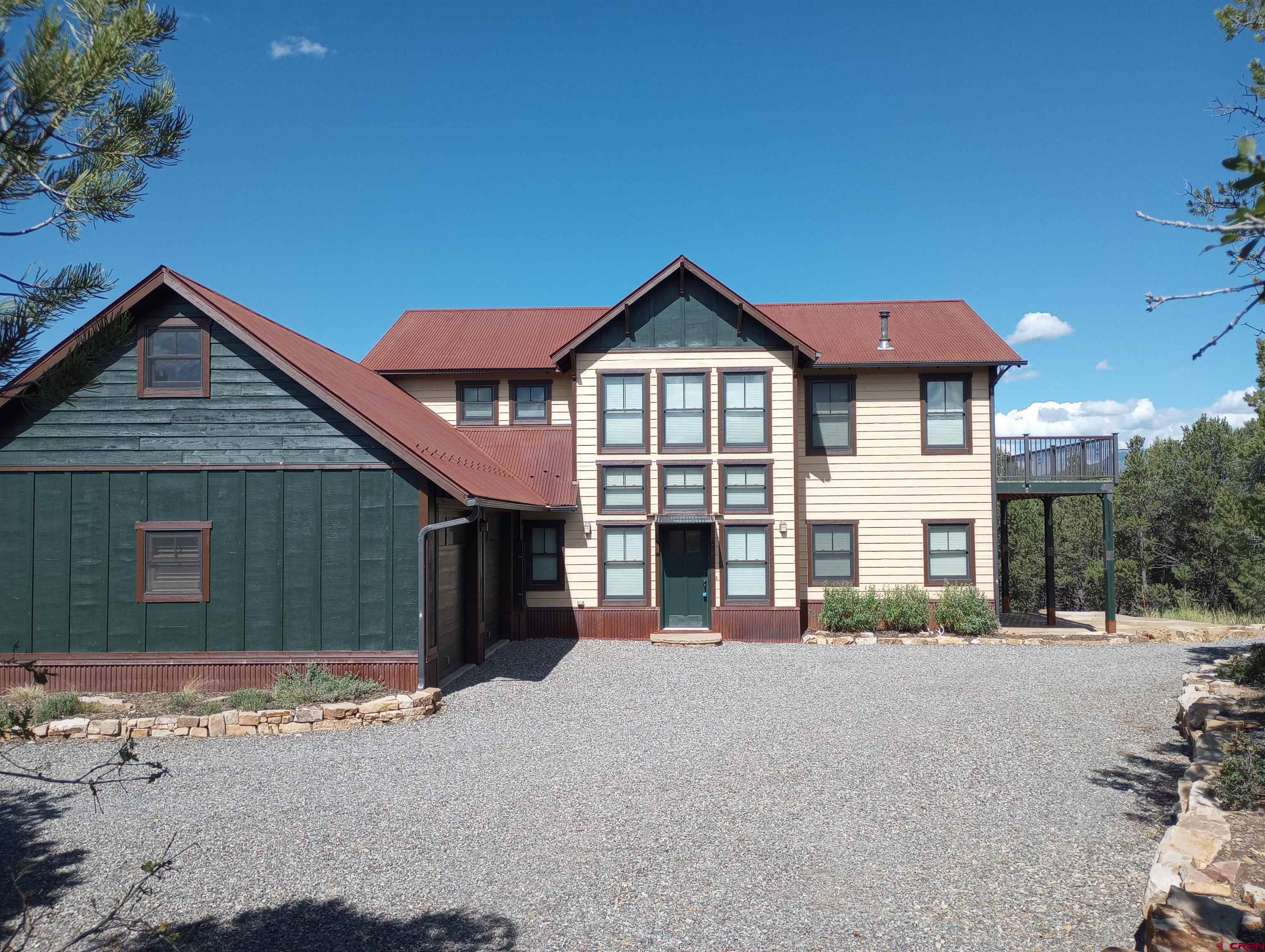 41 Oak Road Ridgway, CO 81432 - Photo 16 of 33 a front view of a house with a yard