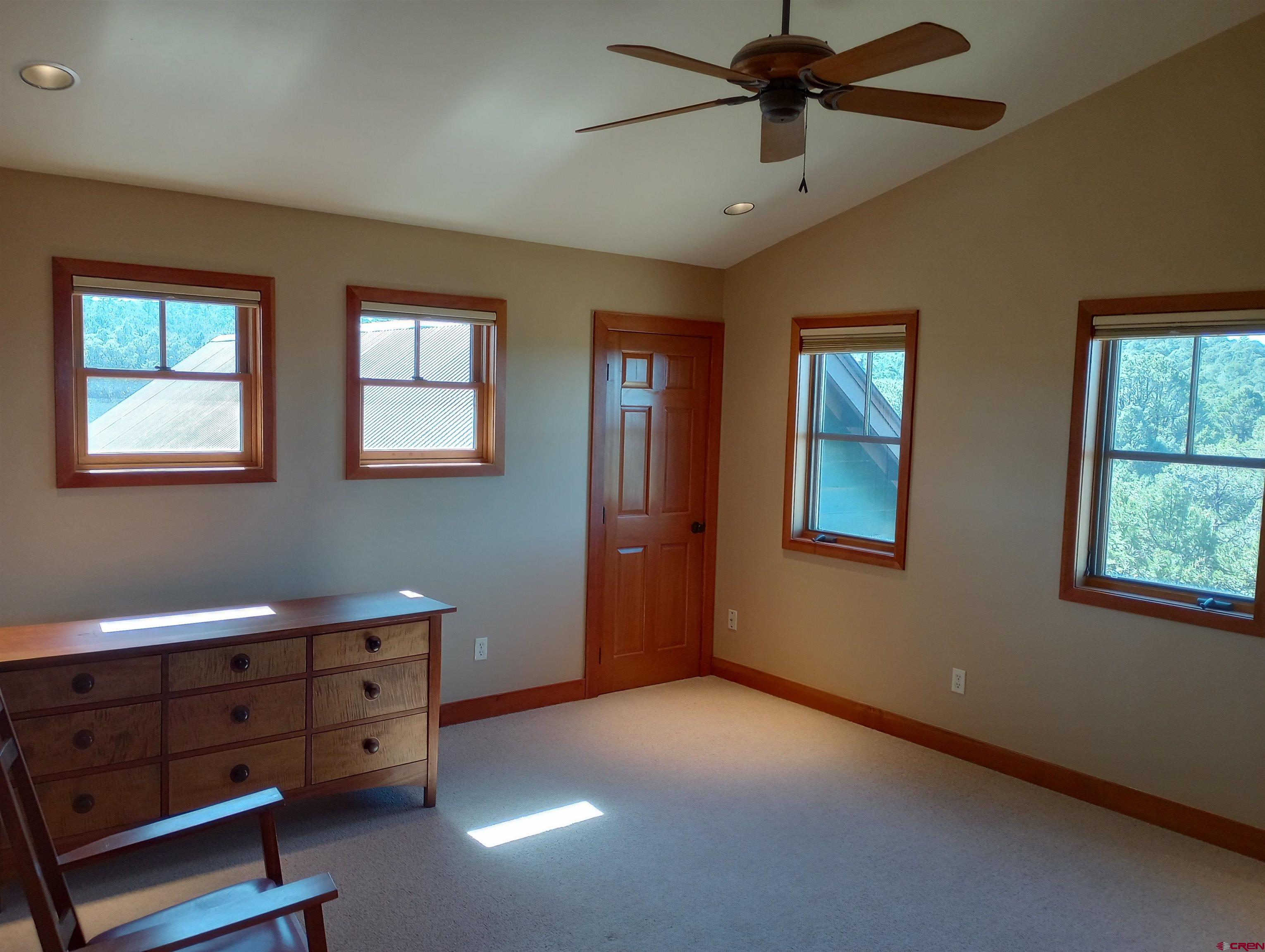 41 Oak Road Ridgway, CO 81432 - Photo 22 of 33 an empty room with windows and fan