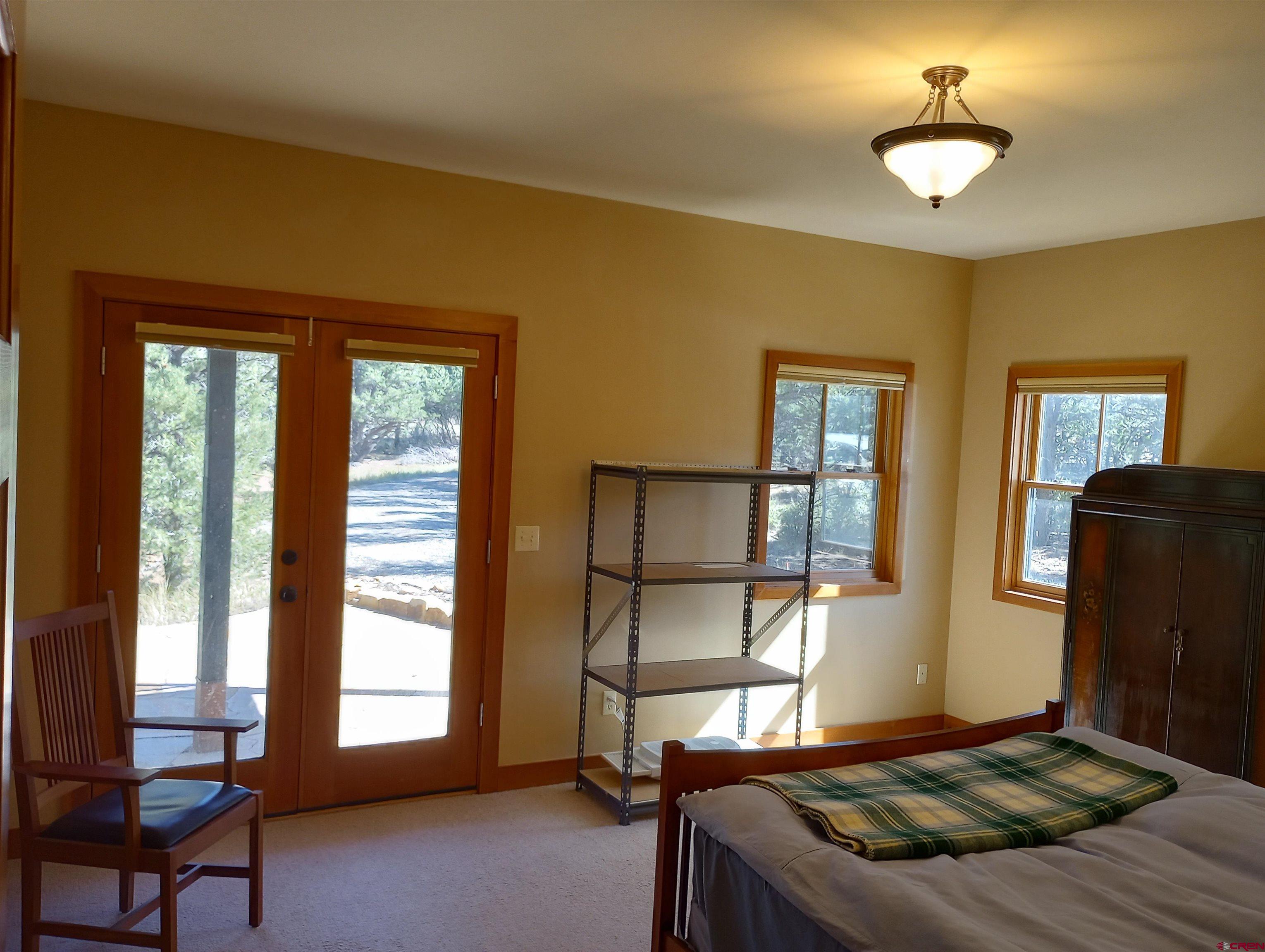 41 Oak Road Ridgway, CO 81432 - Photo 29 of 33 a bedroom with bed and window