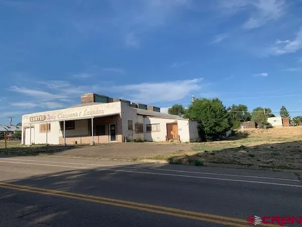 a view of a house with a street