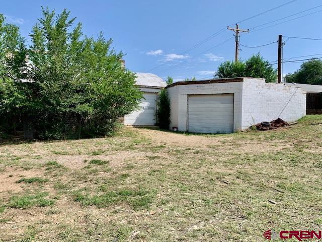 500 South Market Street Cortez, CO 81321 - Photo 3 of 12 a view of a backyard of the house
