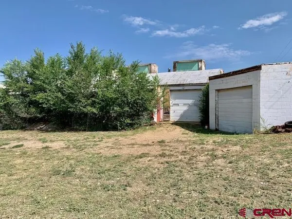 a house with trees in front of it