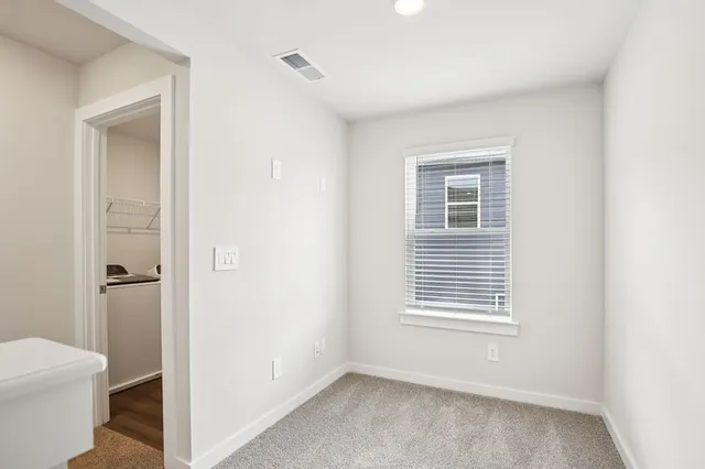 a view of a room that has a window in it