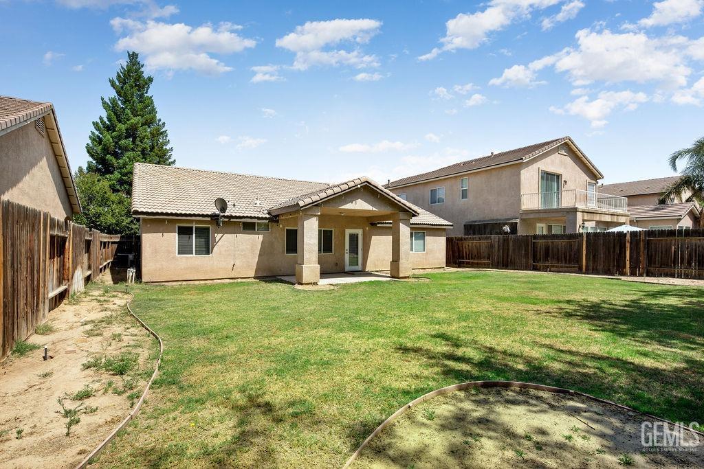 Undisclosed Address Bakersfield, CA 93312 - Photo 19 of 21 a house that has a big yard with large trees
