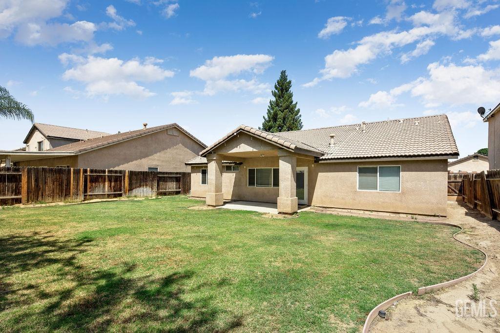 Undisclosed Address Bakersfield, CA 93312 - Photo 20 of 21 a front view of a house with a yard
