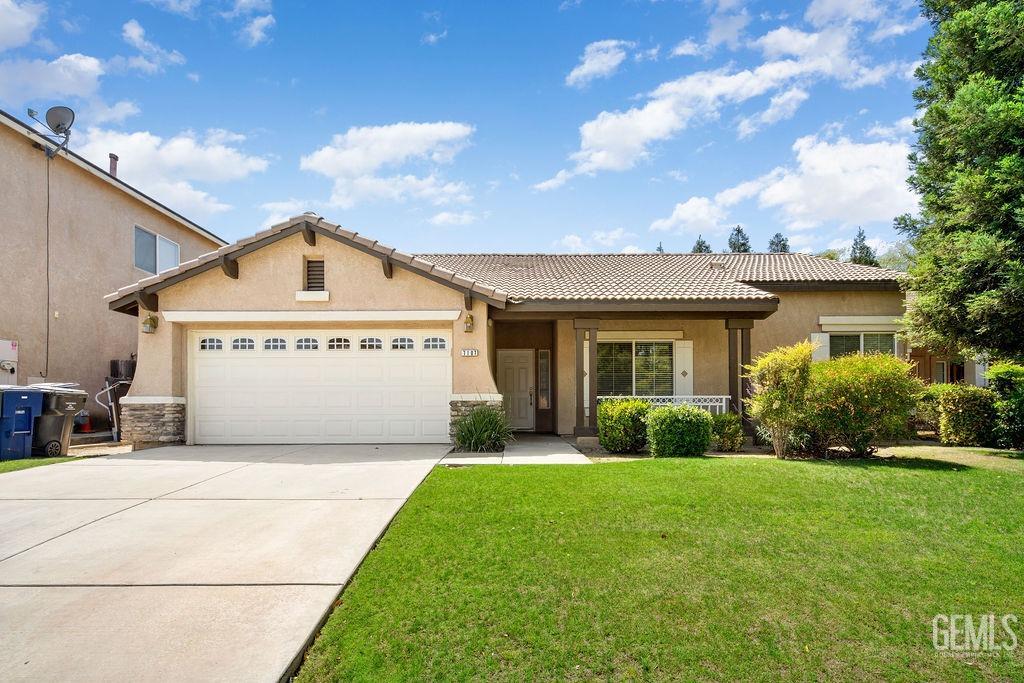 Undisclosed Address Bakersfield, CA 93312 - Photo 2 of 21 a view of a house with a yard