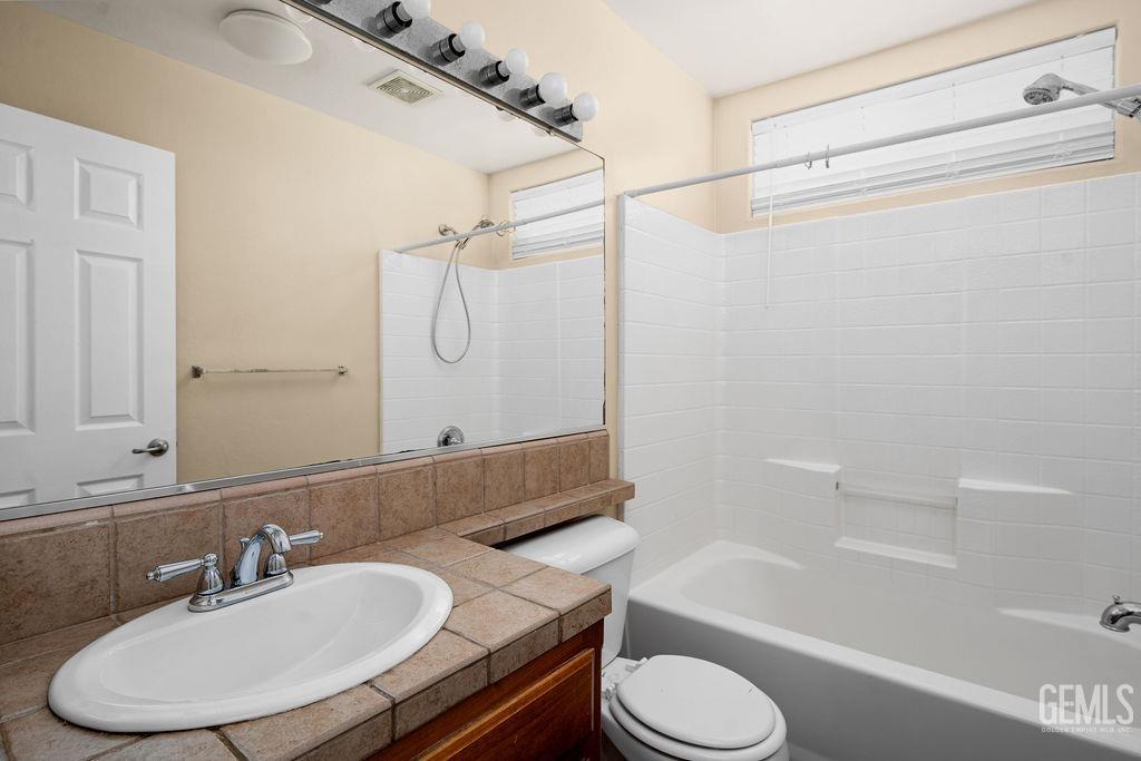 Undisclosed Address Bakersfield, CA 93312 - Photo 6 of 21 a bathroom with a sink toilet and shower