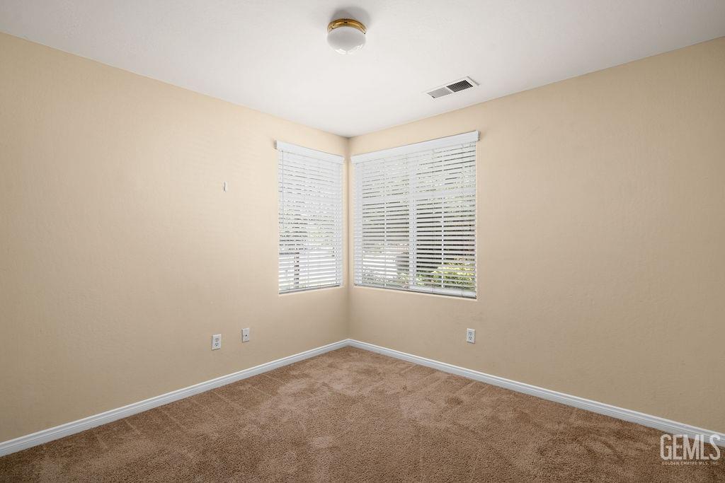 Undisclosed Address Bakersfield, CA 93312 - Photo 8 of 21 a view of an empty room with a window