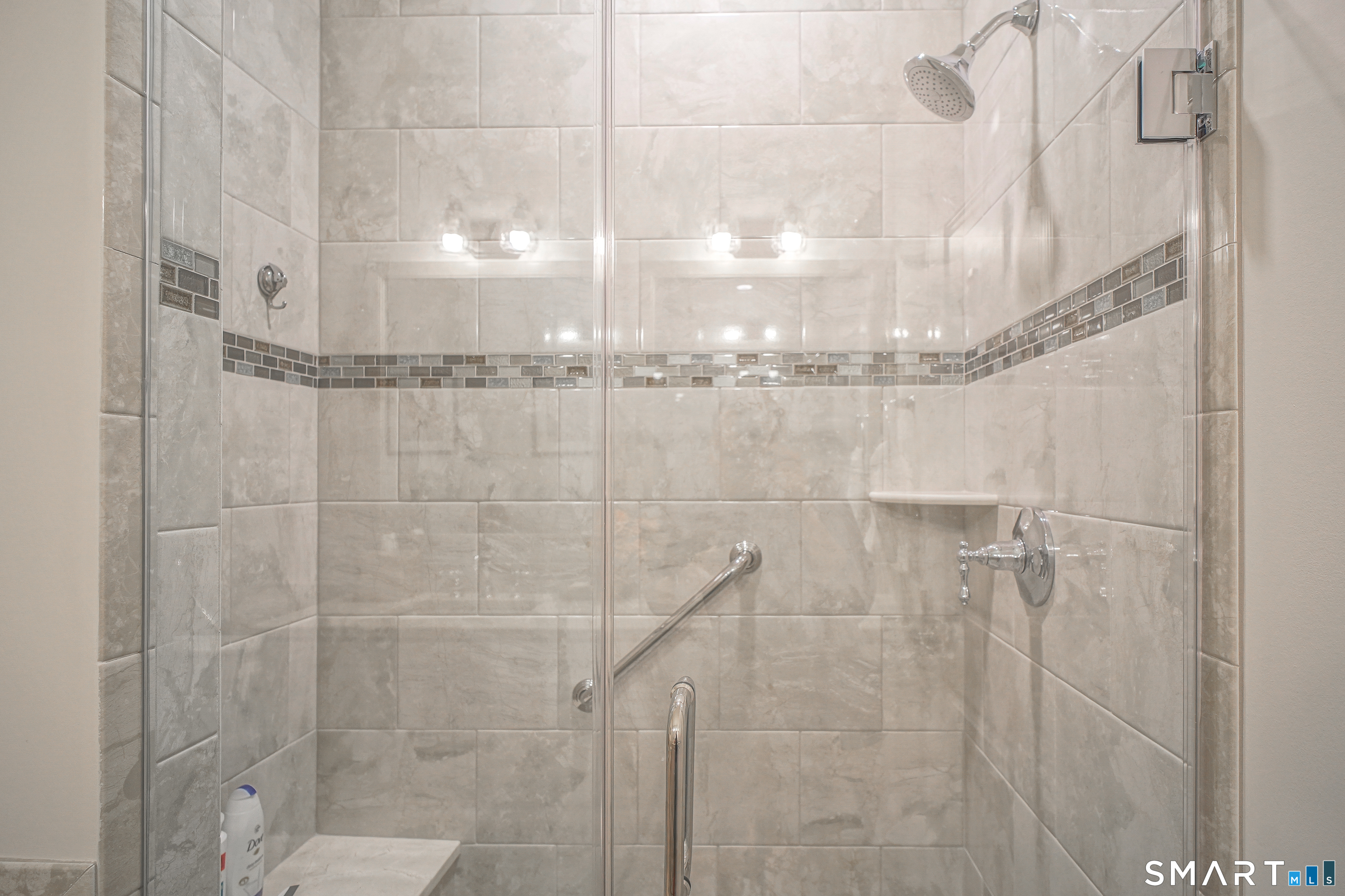 28 Tamarack Court, Unit 28 Prospect, CT 06712 - Photo 15 of 40 Beautiful titled shower with seat, glass doors, and an upgraded showerhead.
