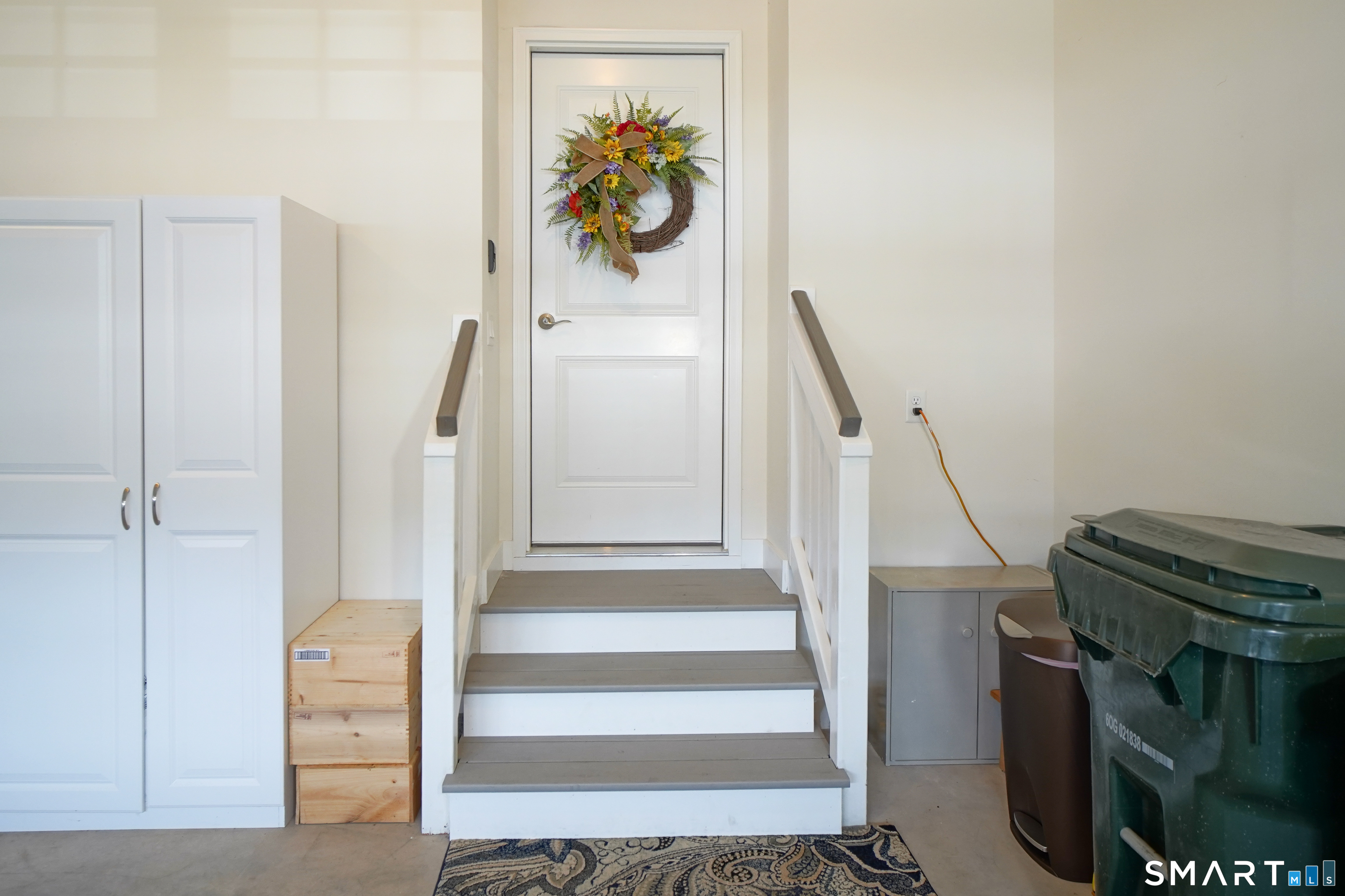 28 Tamarack Court, Unit 28 Prospect, CT 06712 - Photo 22 of 40 Custom stairs from garage to mud room with rails. Easy to unload groceries in the kitchen.