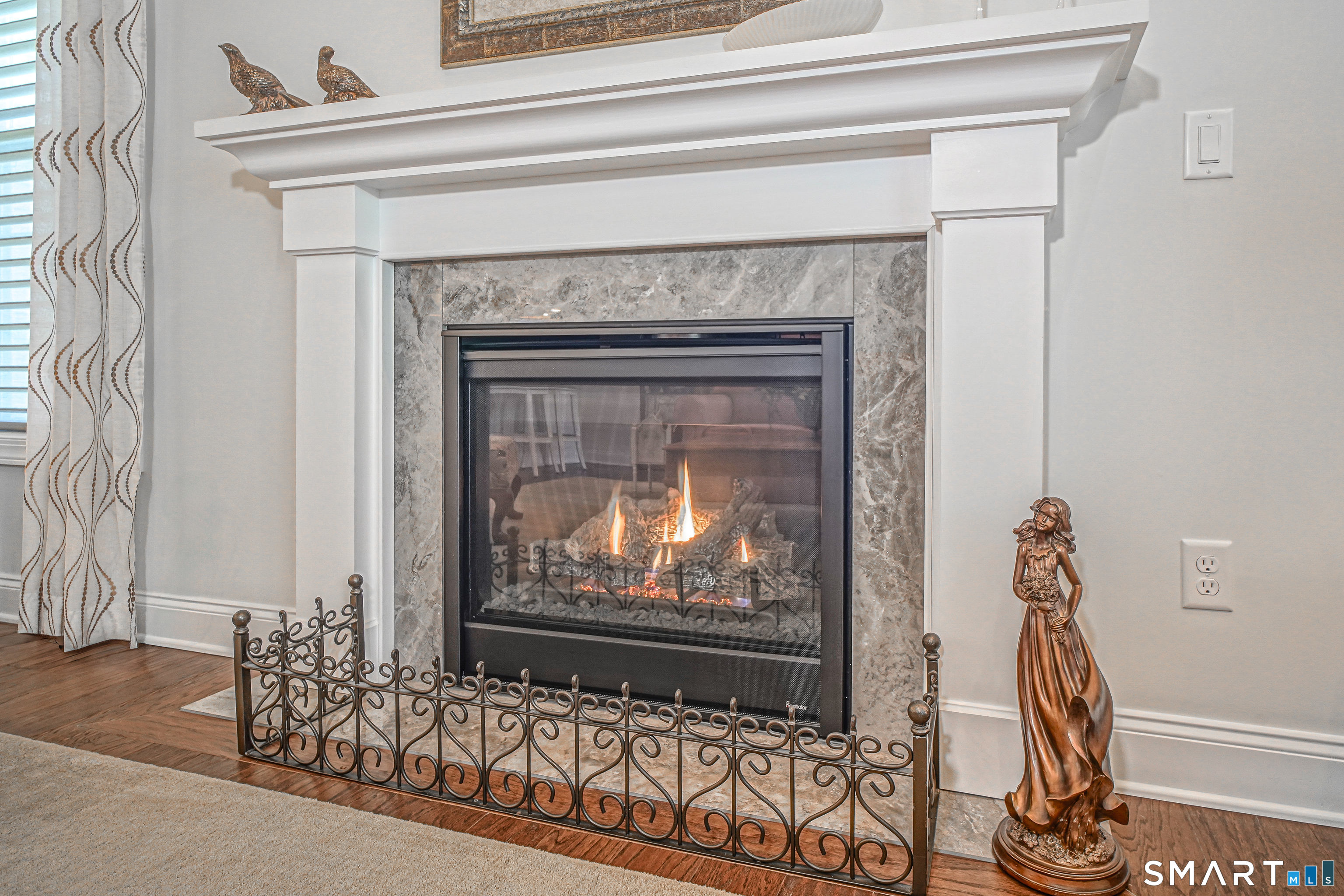 28 Tamarack Court, Unit 28 Prospect, CT 06712 - Photo 3 of 40 Enjoy the gas fireplace with a click of the switch. Marble hearth with detailed woodwork and decorative grate