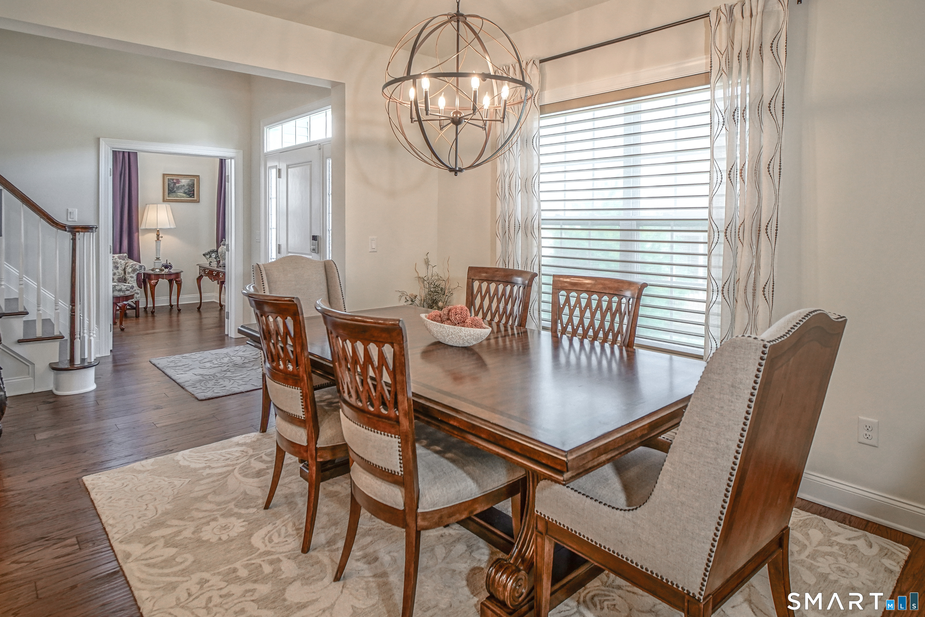 28 Tamarack Court, Unit 28 Prospect, CT 06712 - Photo 39 of 40 Open floor plan, spacious enough to seat a large dining table. All custom blinds and drapes in the lower level are to stay.